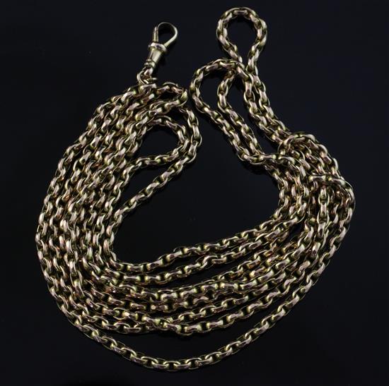 An Edwardian 9ct gold guard chain, 57.5in.